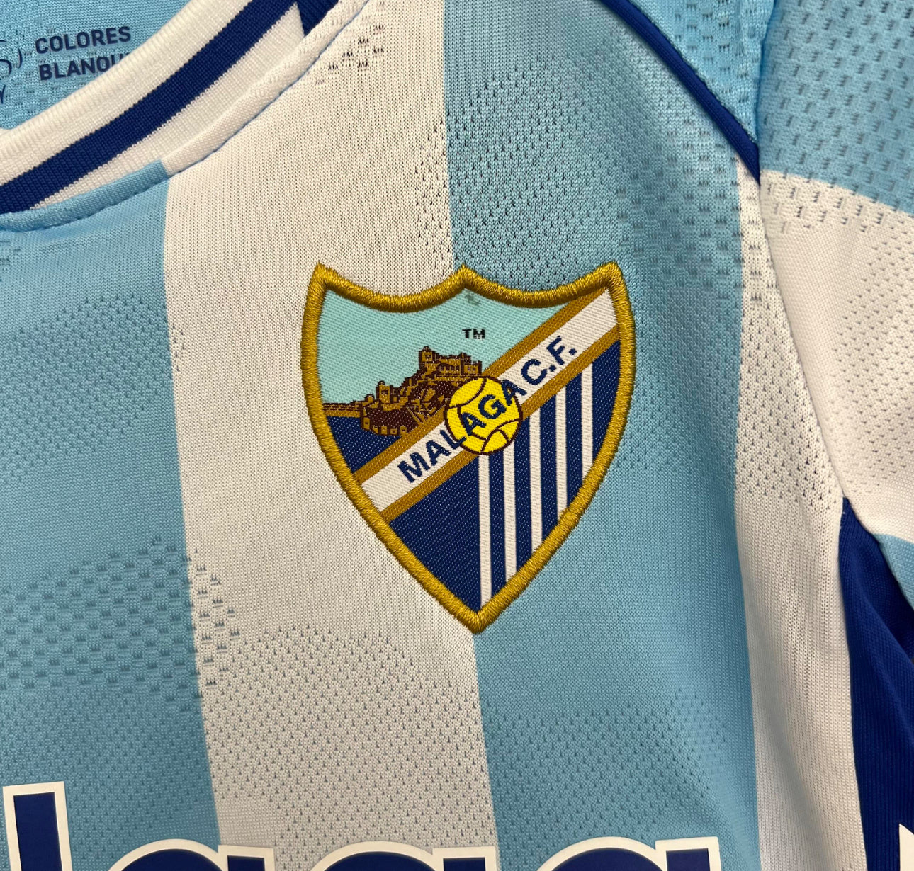 Malaga CF Heimtrikot für Kinder. 25/26