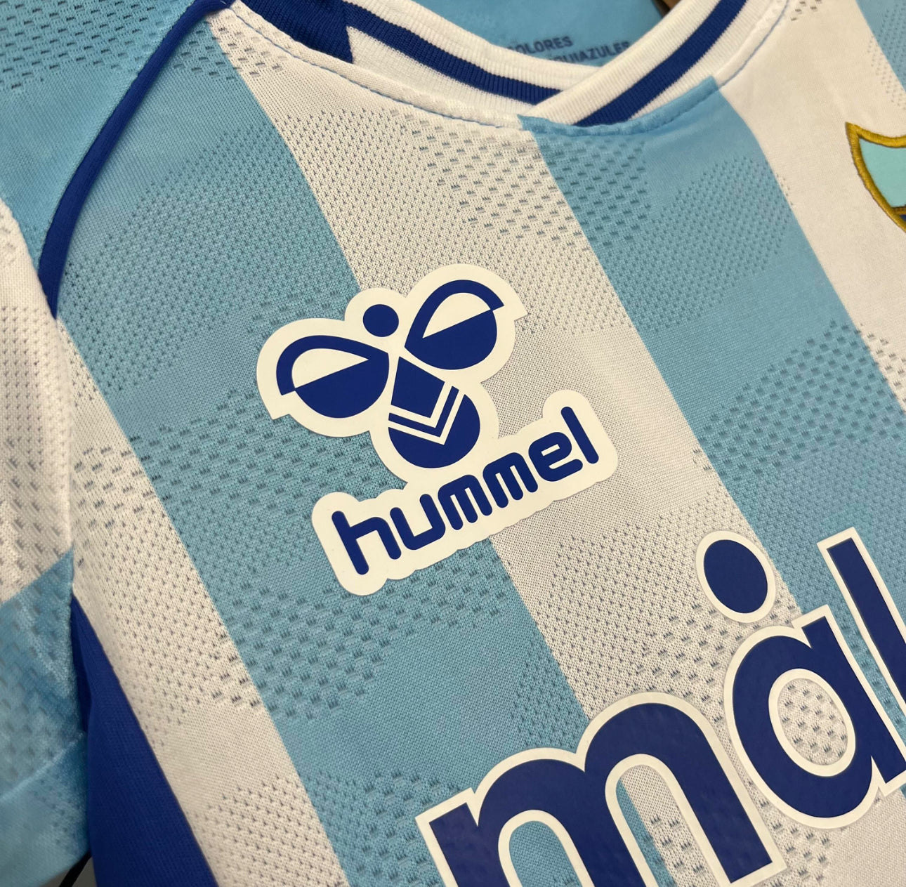 Malaga CF Heimtrikot für Kinder. 25/26